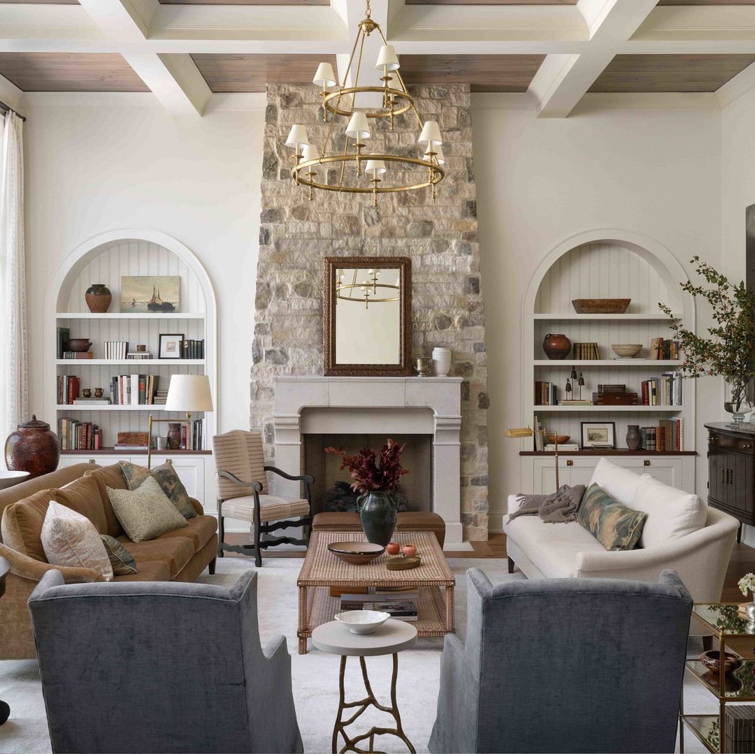 a living room filled with furniture and a fire place