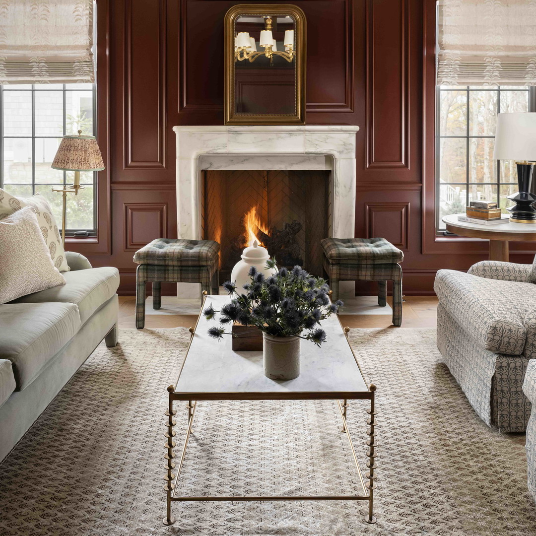 a living room filled with furniture and a fire place