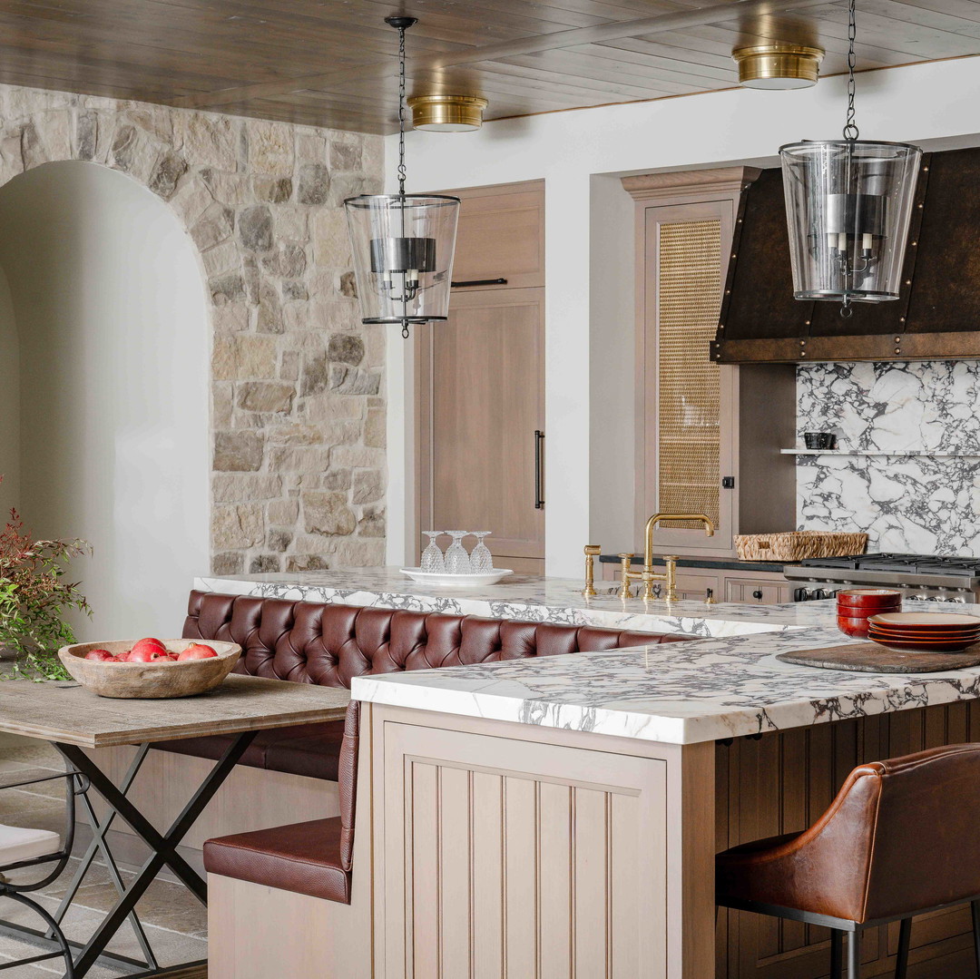 a large kitchen with a marble counter top