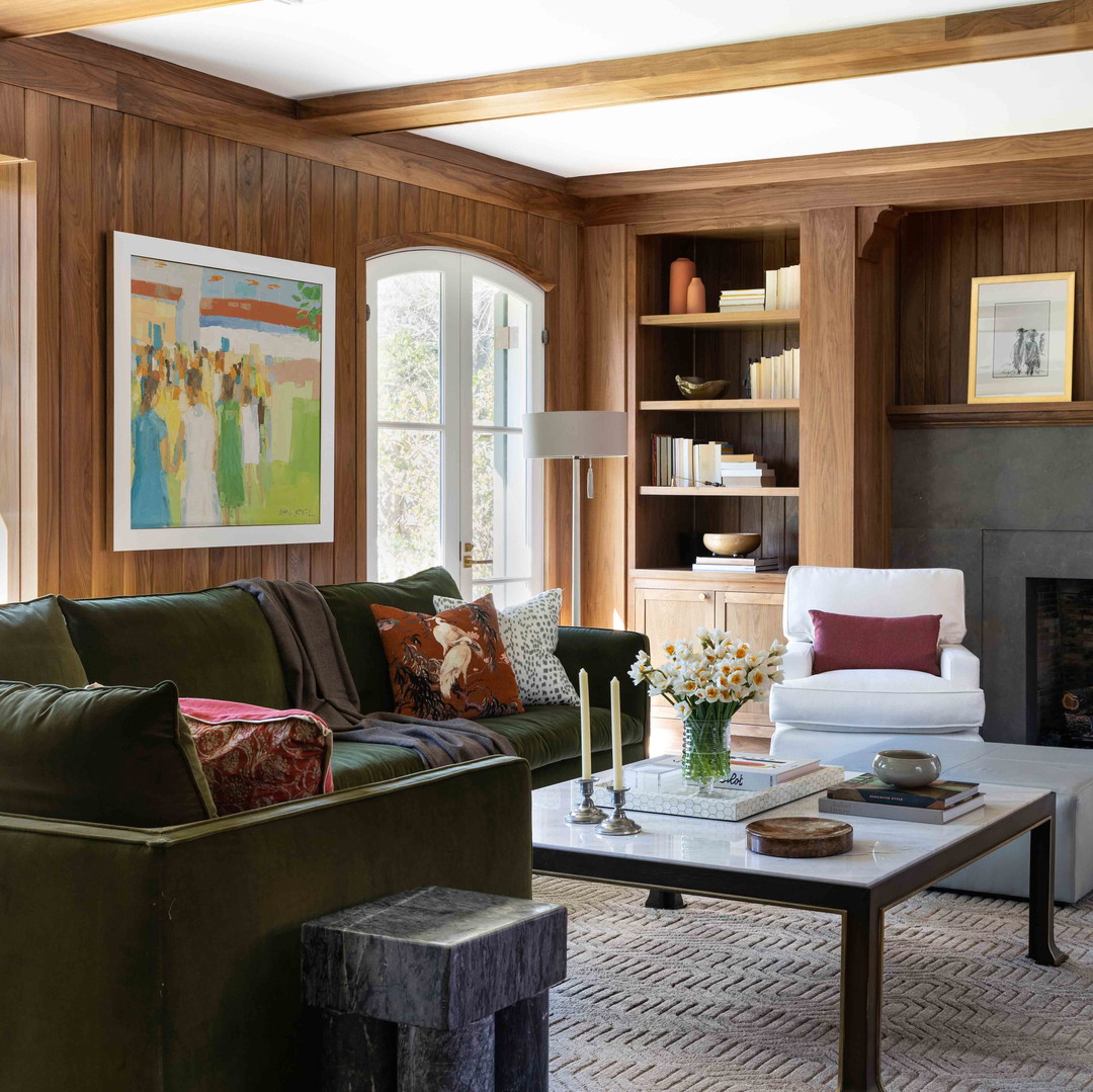 a living room filled with furniture and a fire place