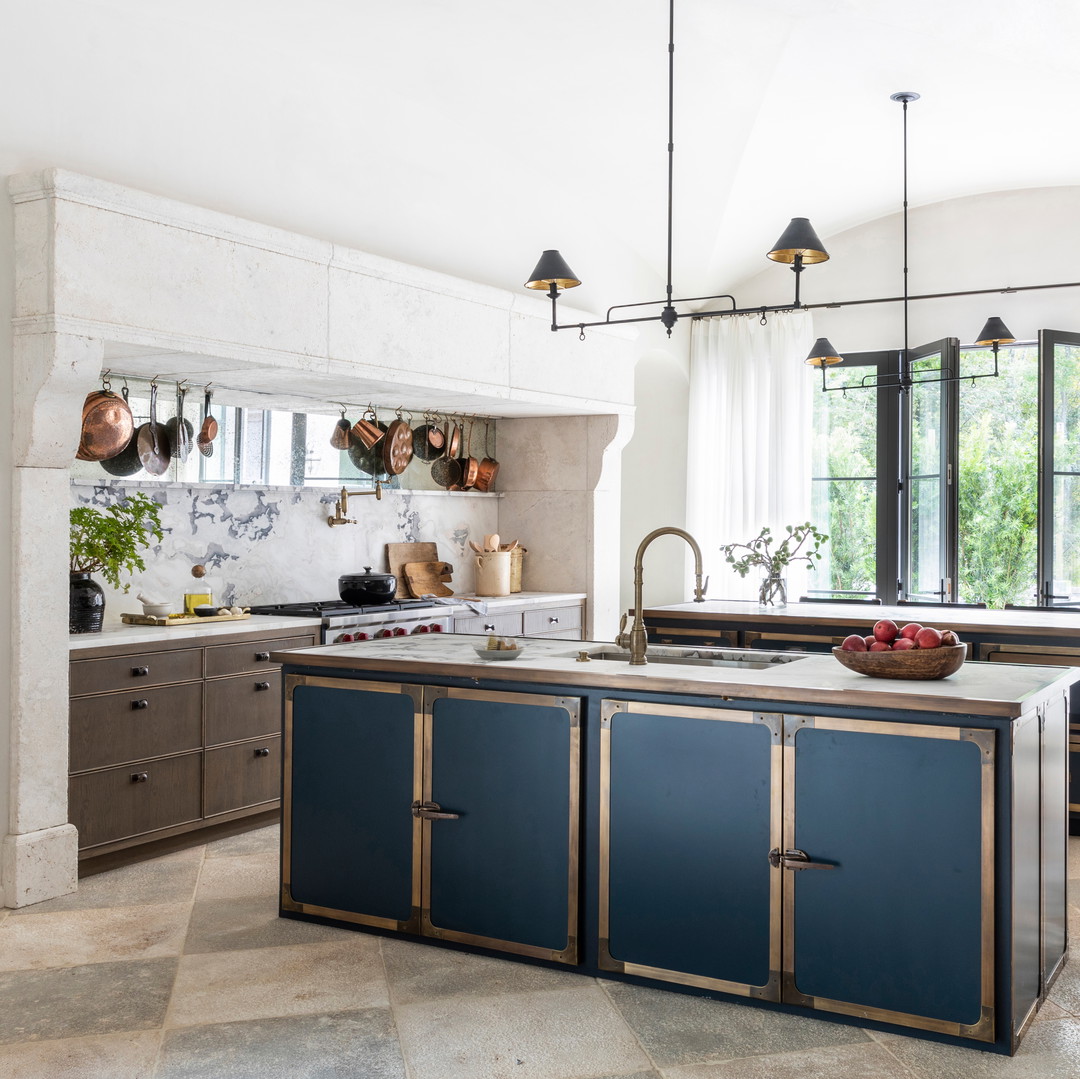 a kitchen with a center island and a sink