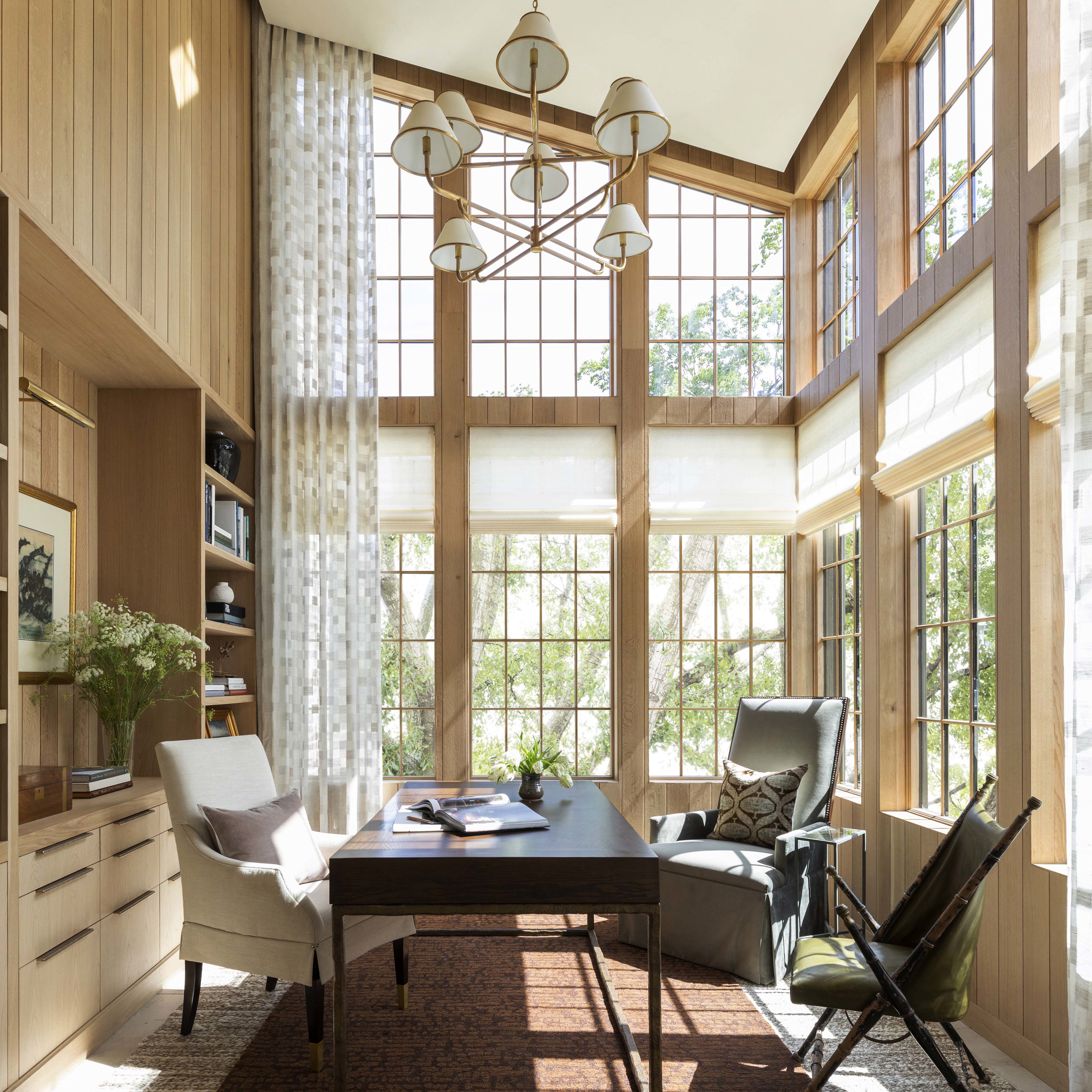 a living room with a table and chairs