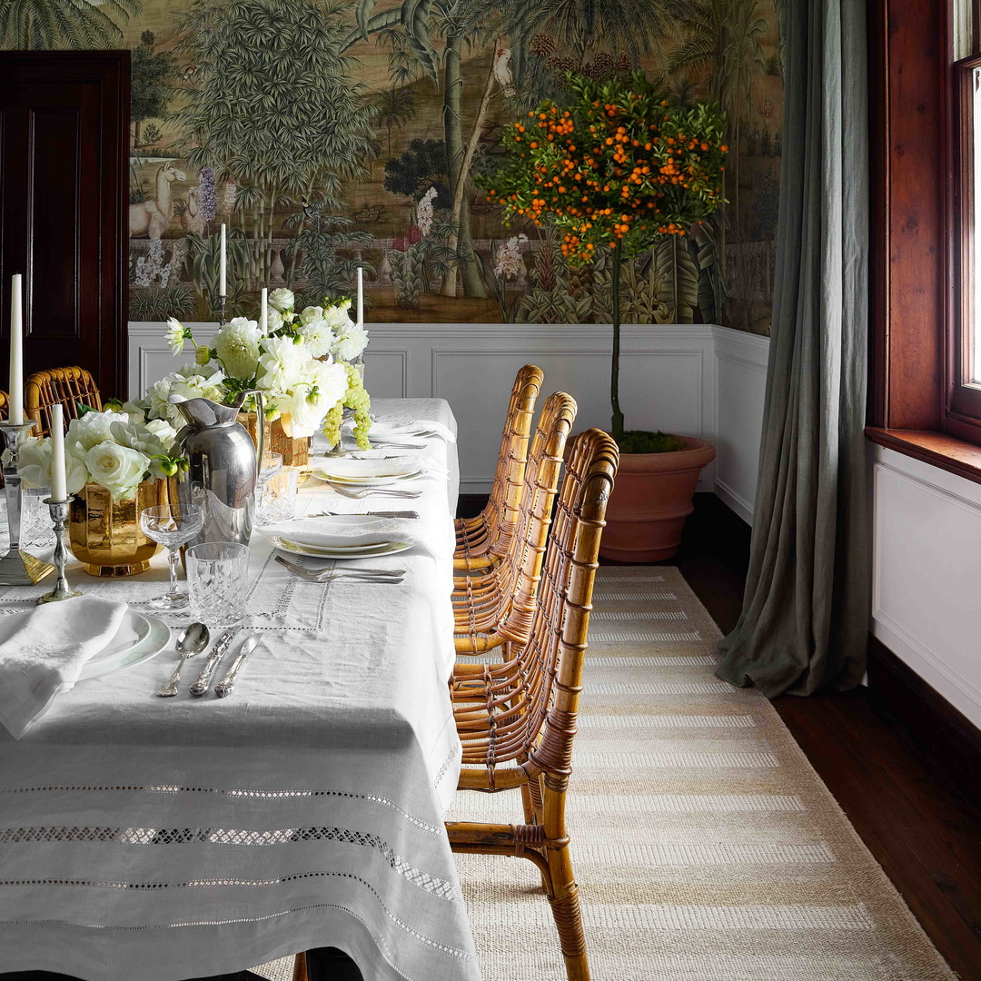 a dining room with a table and chairs