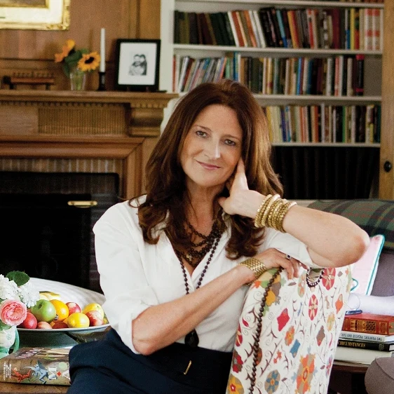 a woman sitting in a chair in a living room