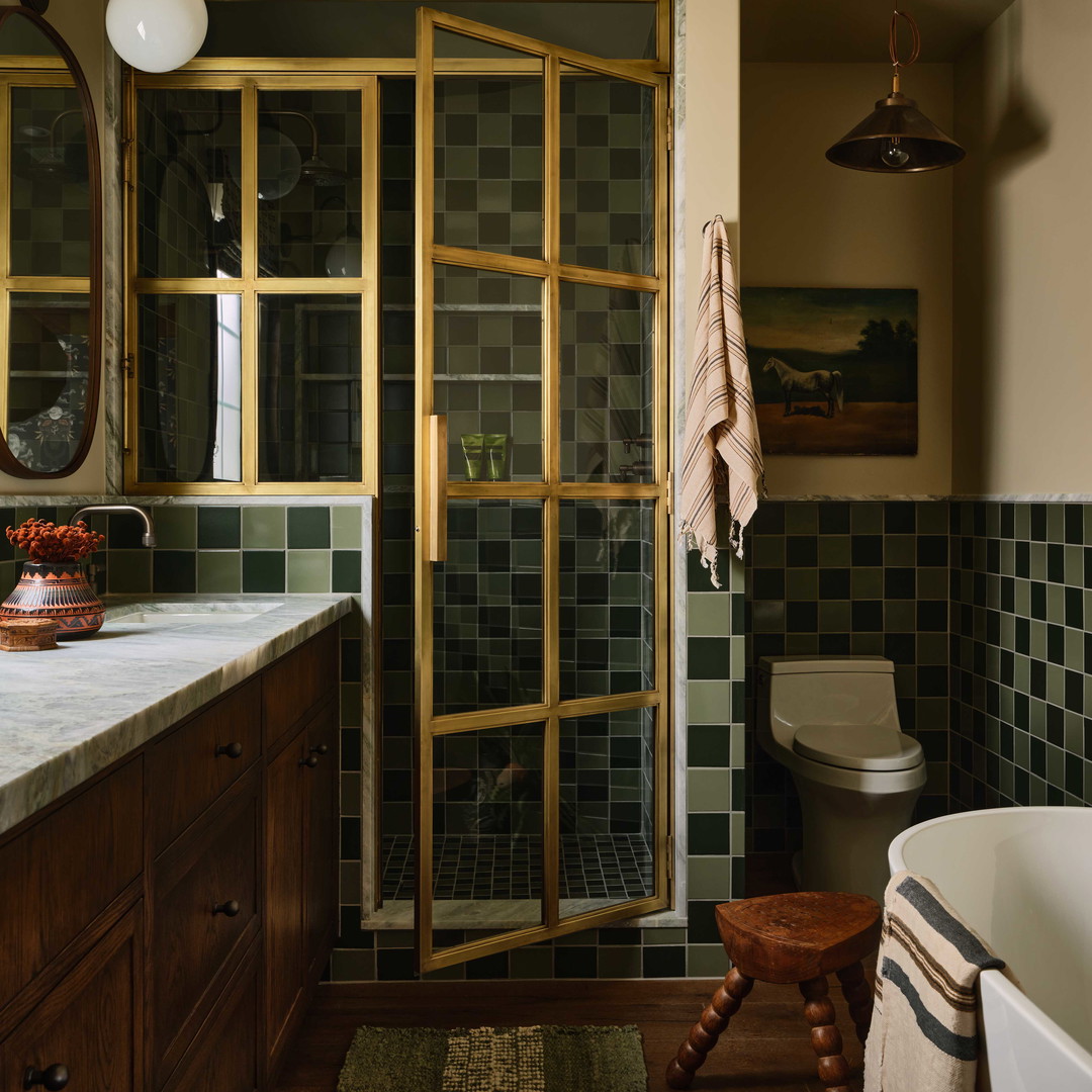 a bath room with a toilet a sink and a bath tub