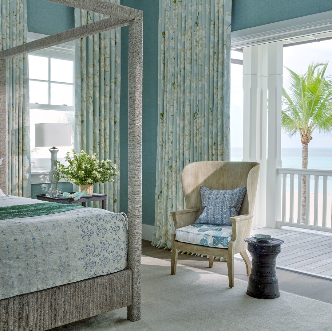 a bedroom with a bed and a chair
