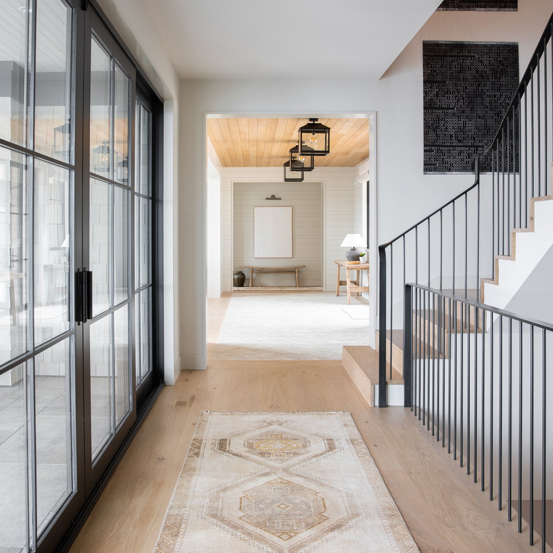 a long hallway with a rug on the floor