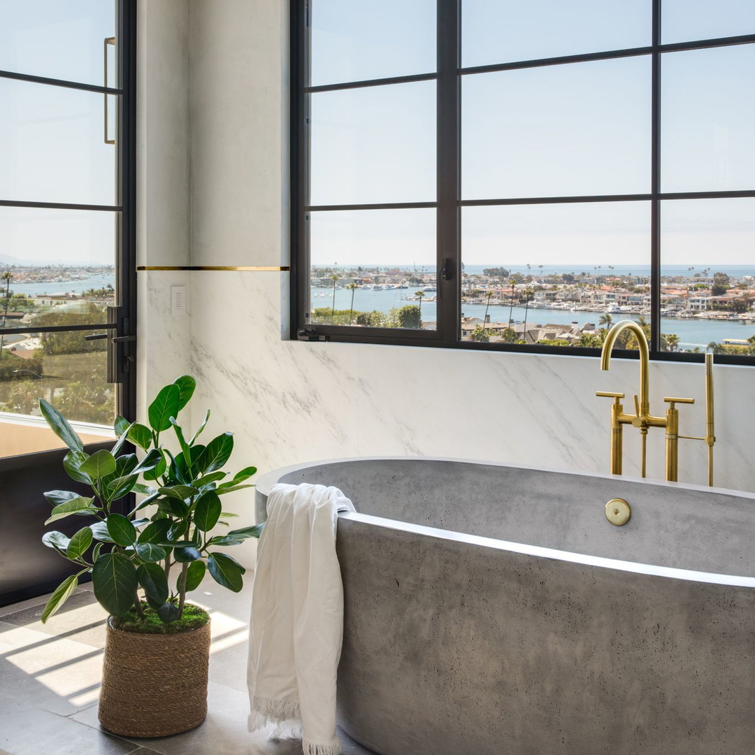 a bathroom with a large tub and a large window