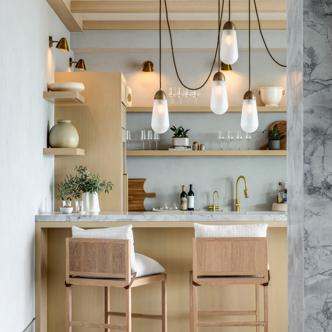 a kitchen with two chairs and a counter