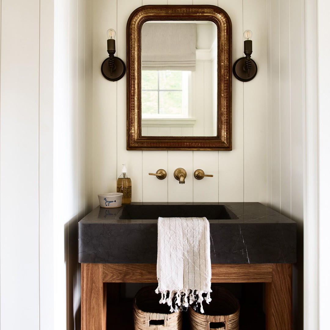 a bathroom sink with a mirror above it