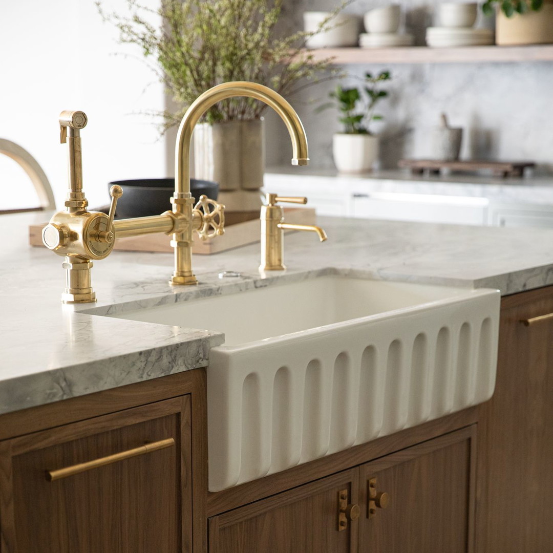 a kitchen with a sink and wooden cabinets