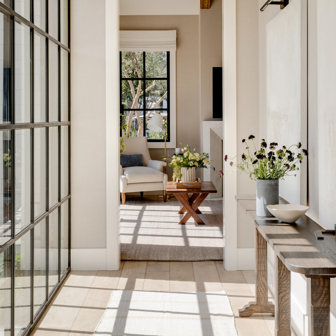 a room with a lot of windows and a couch