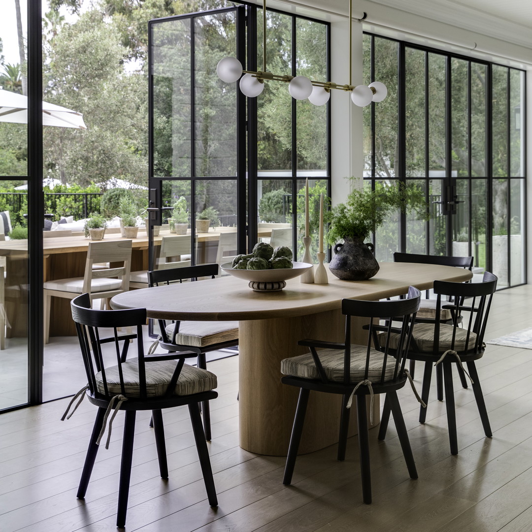 a dining room with a table and chairs