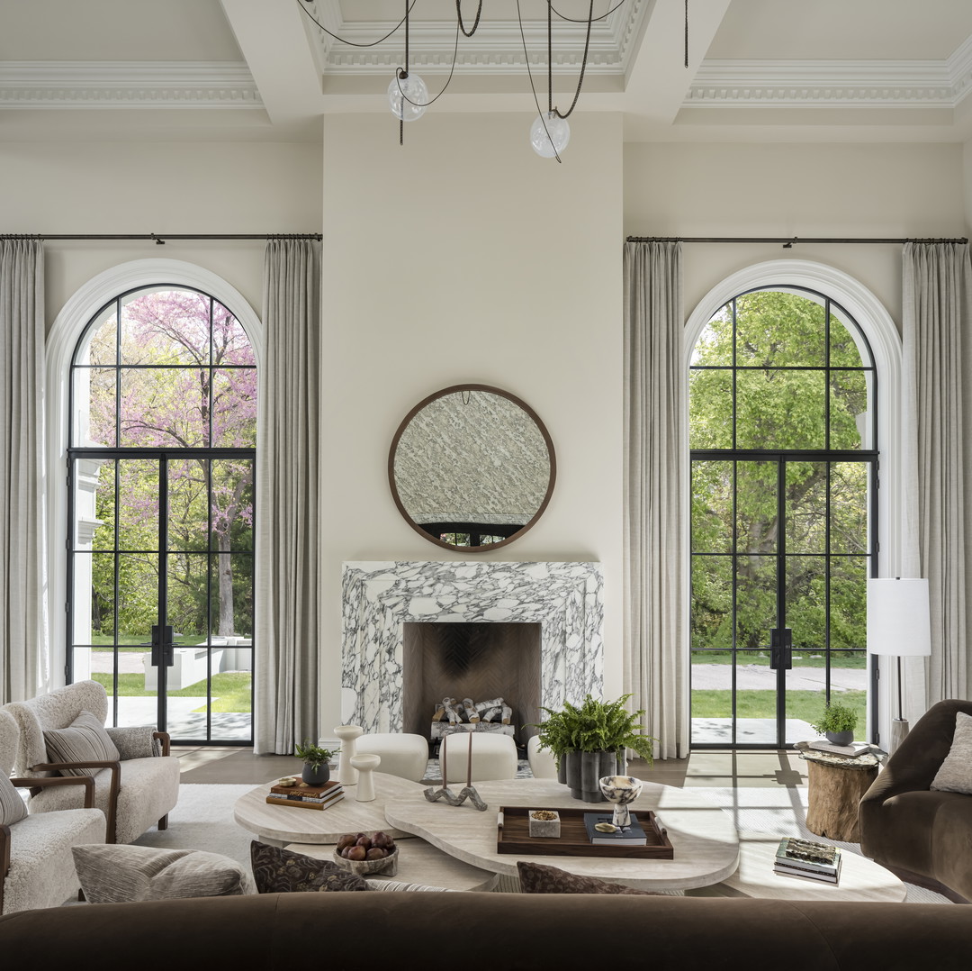 a living room filled with furniture and a fire place