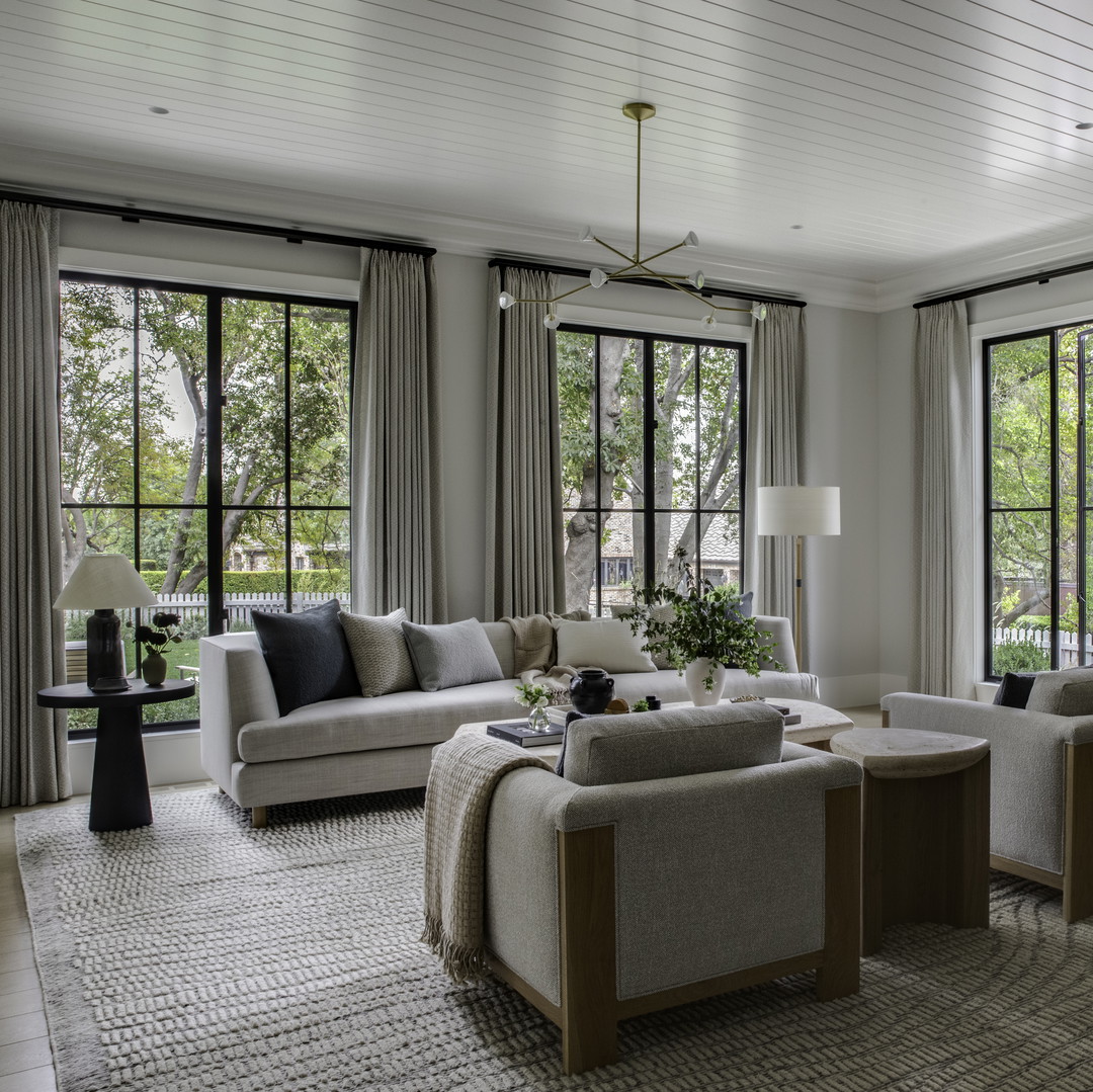 a living room filled with furniture and a fire place