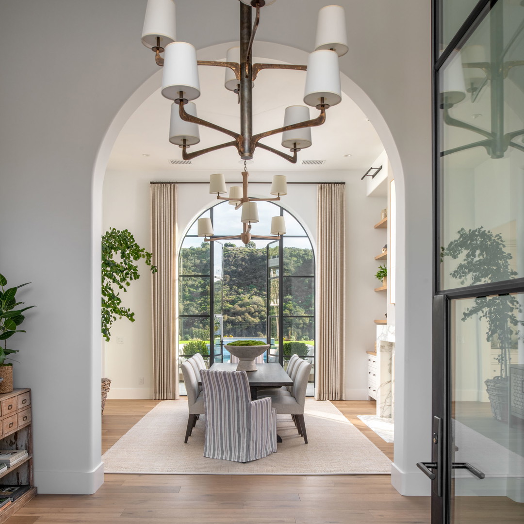 a dining room with a table and chairs