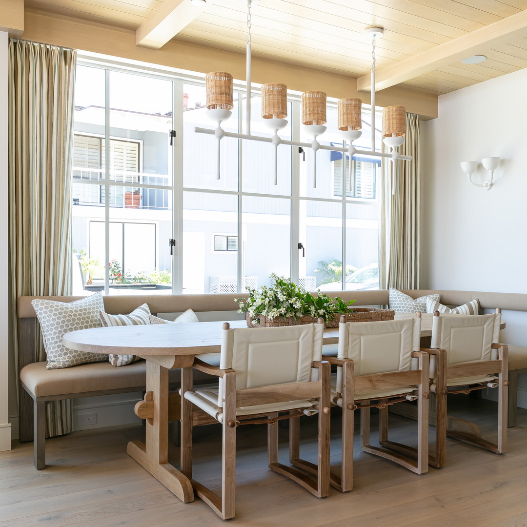 a dining room with a table and benches