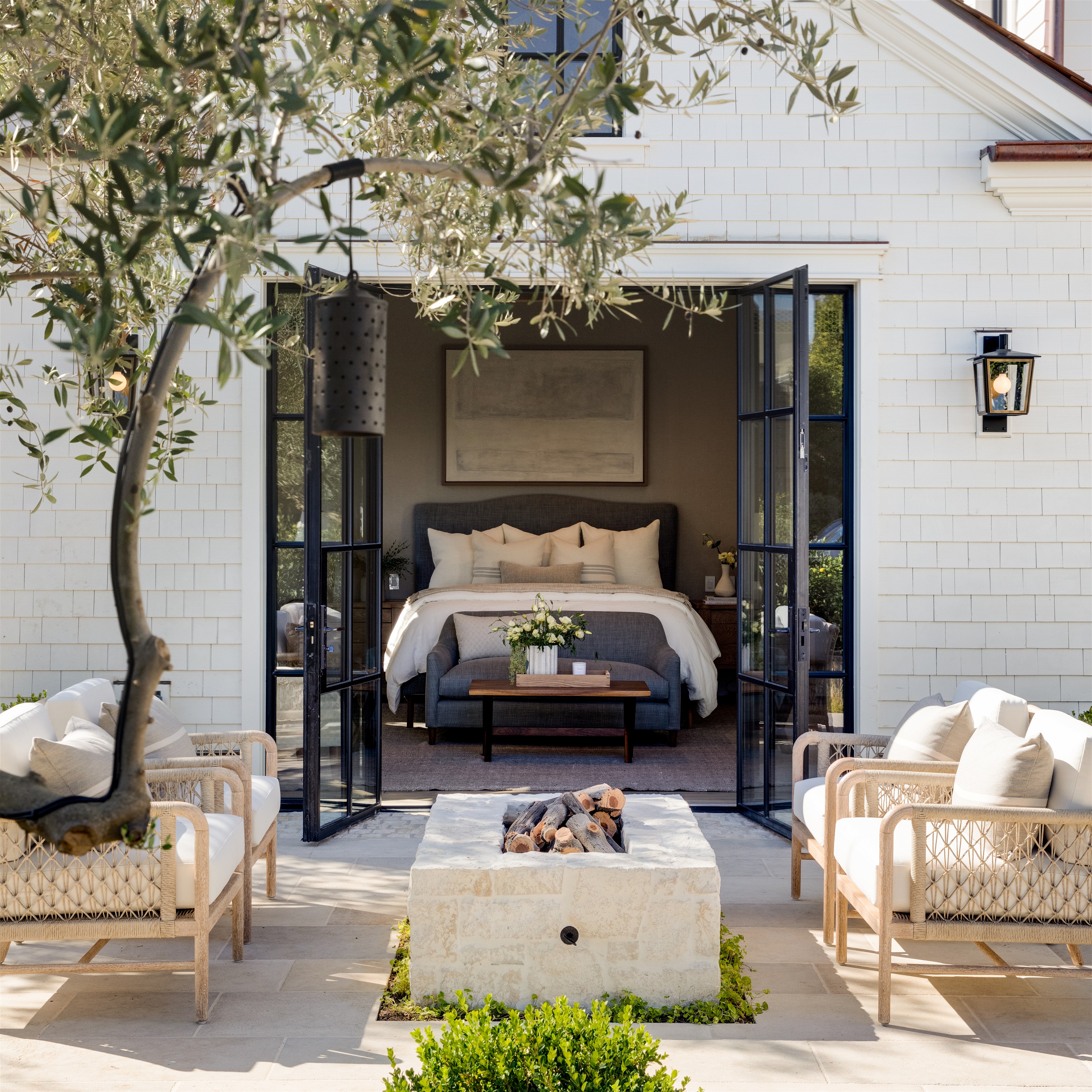 a bedroom with a bed and a patio
