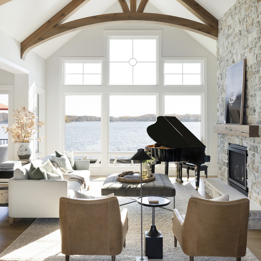 a living room filled with furniture and a piano