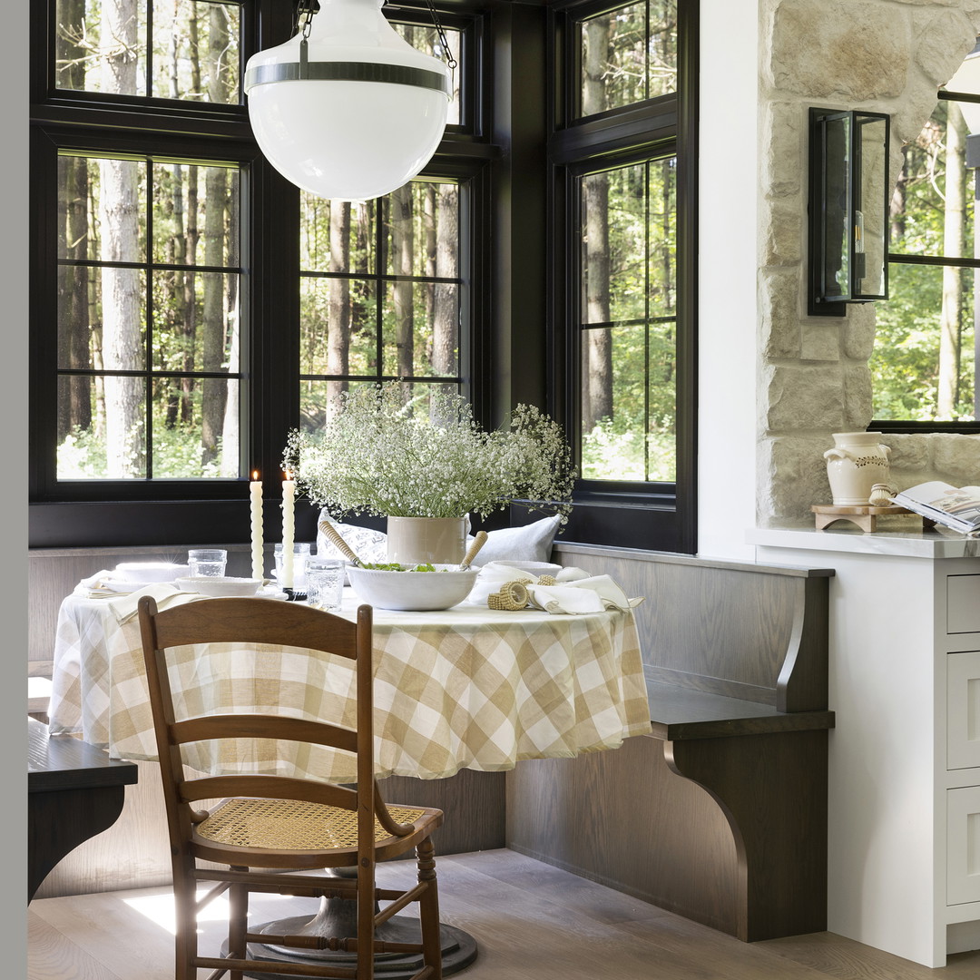 a dining room with a table and chairs