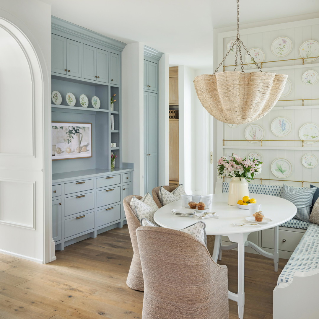 a dining room with a table and chairs