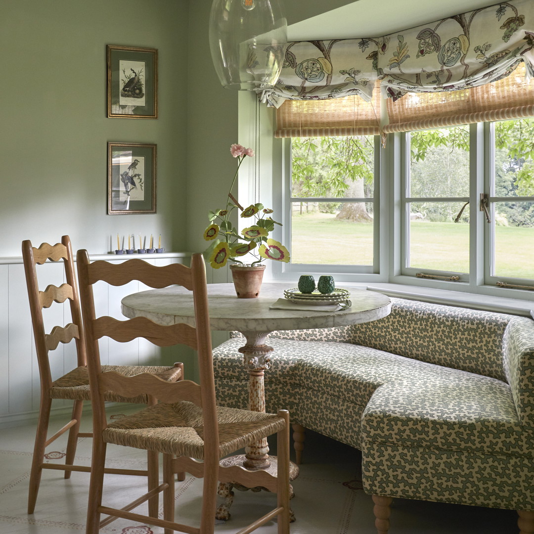 a living room filled with furniture and a window