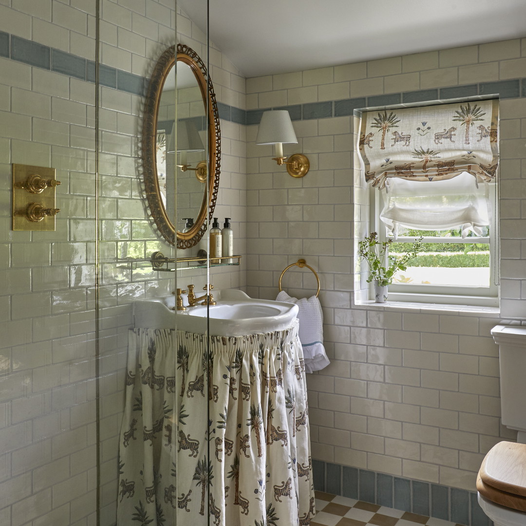 a bathroom with a checkered tile floor and walls