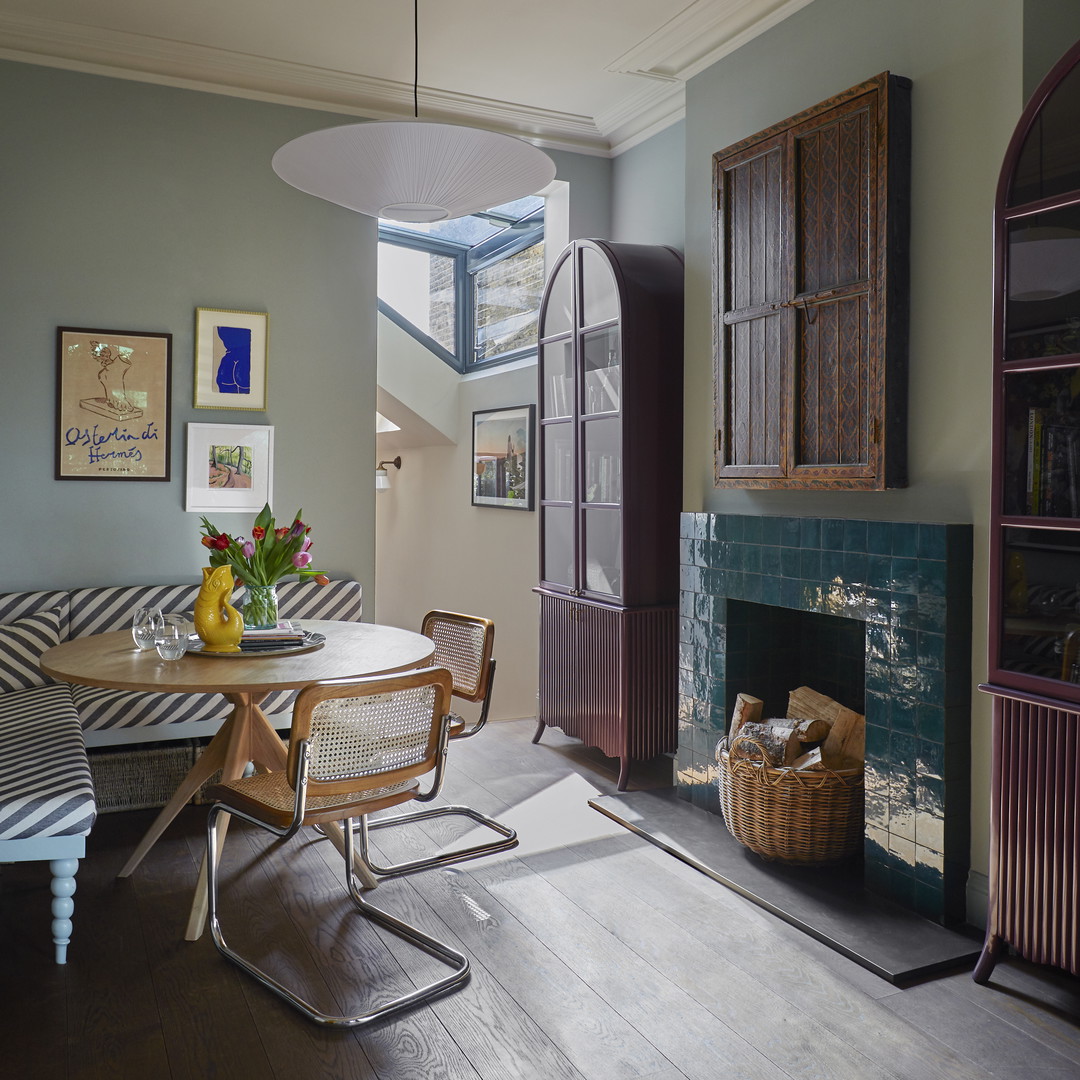 a dining room with a table and chairs