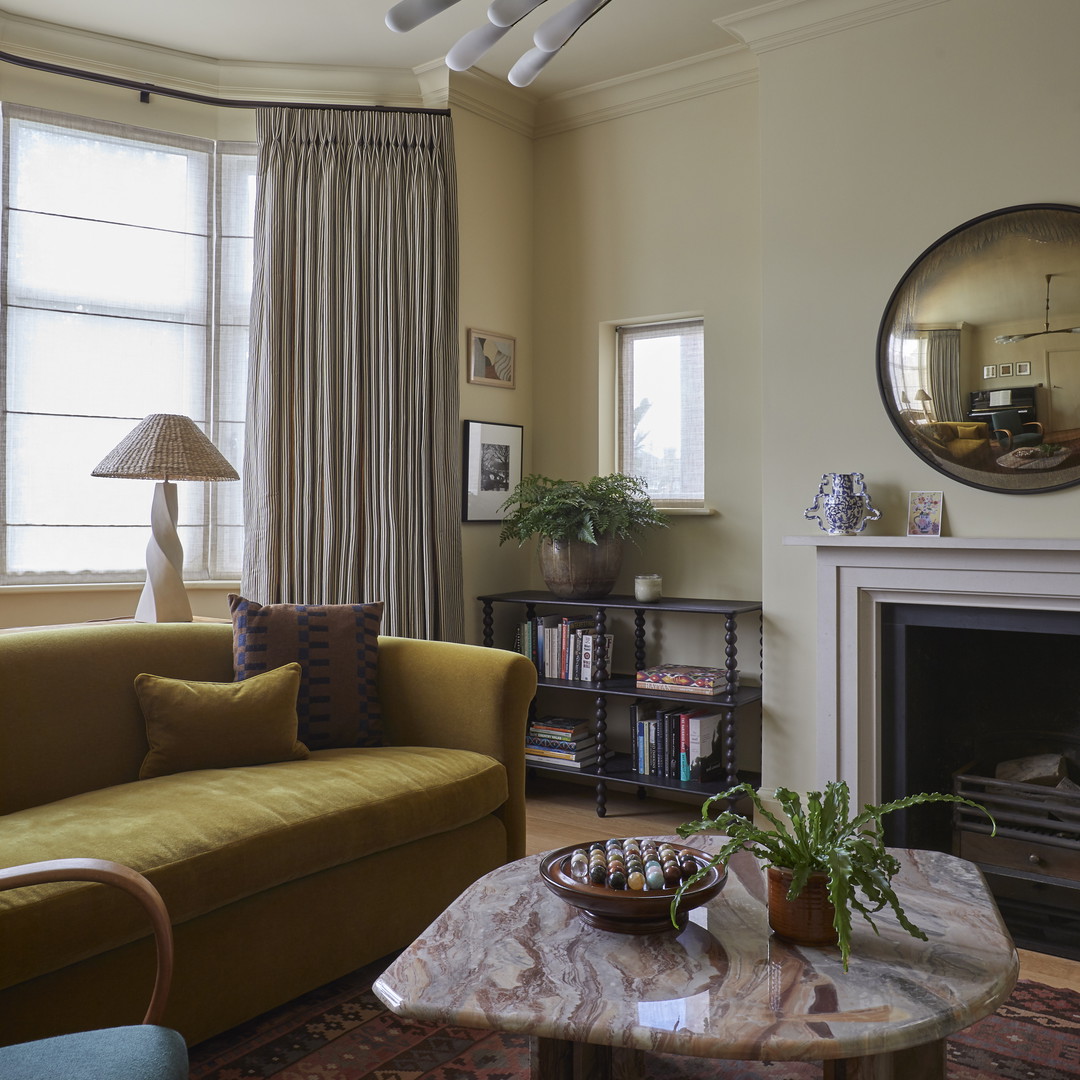 a living room filled with furniture and a fire place