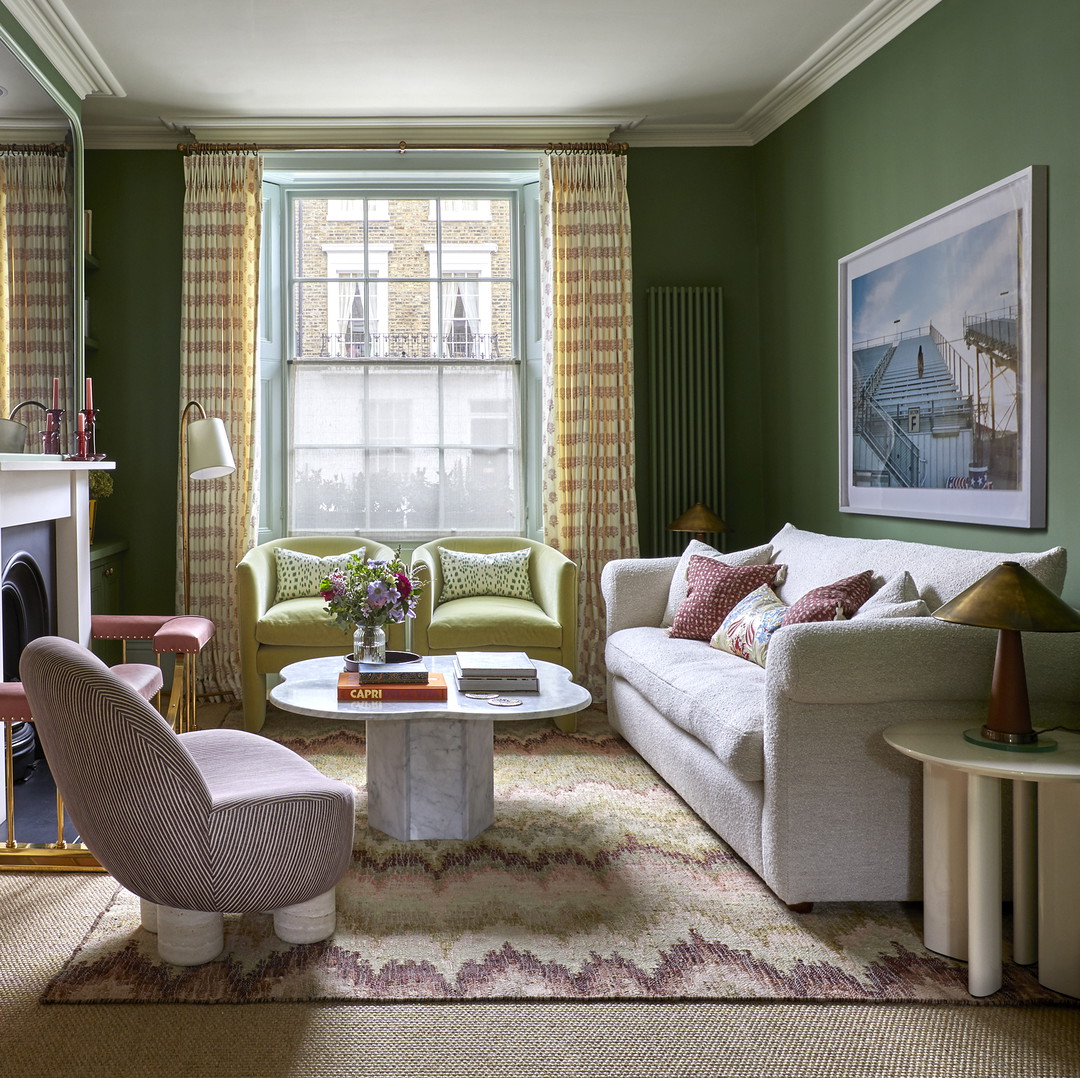 a living room filled with furniture and a fire place