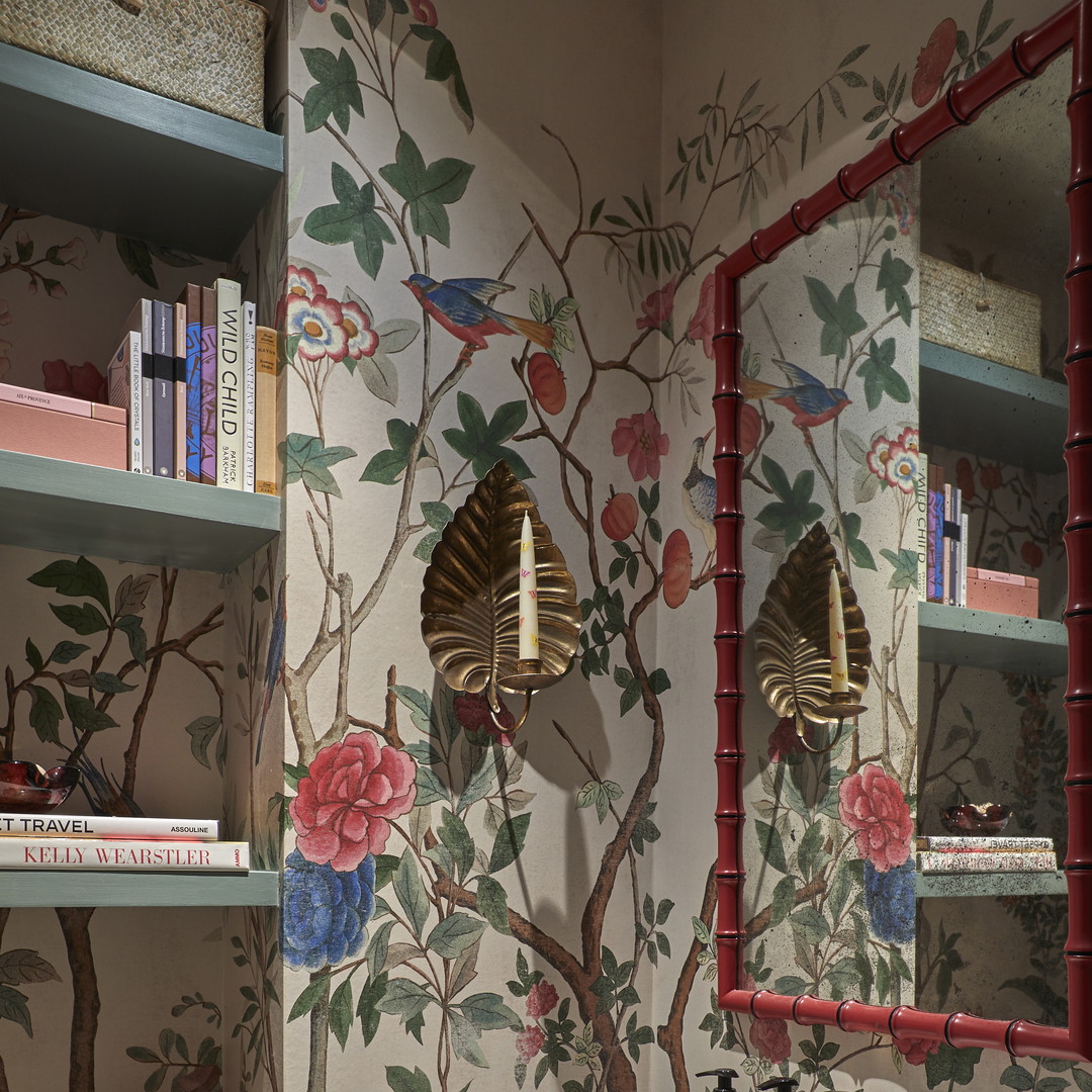 a bathroom with floral wallpaper and a sink