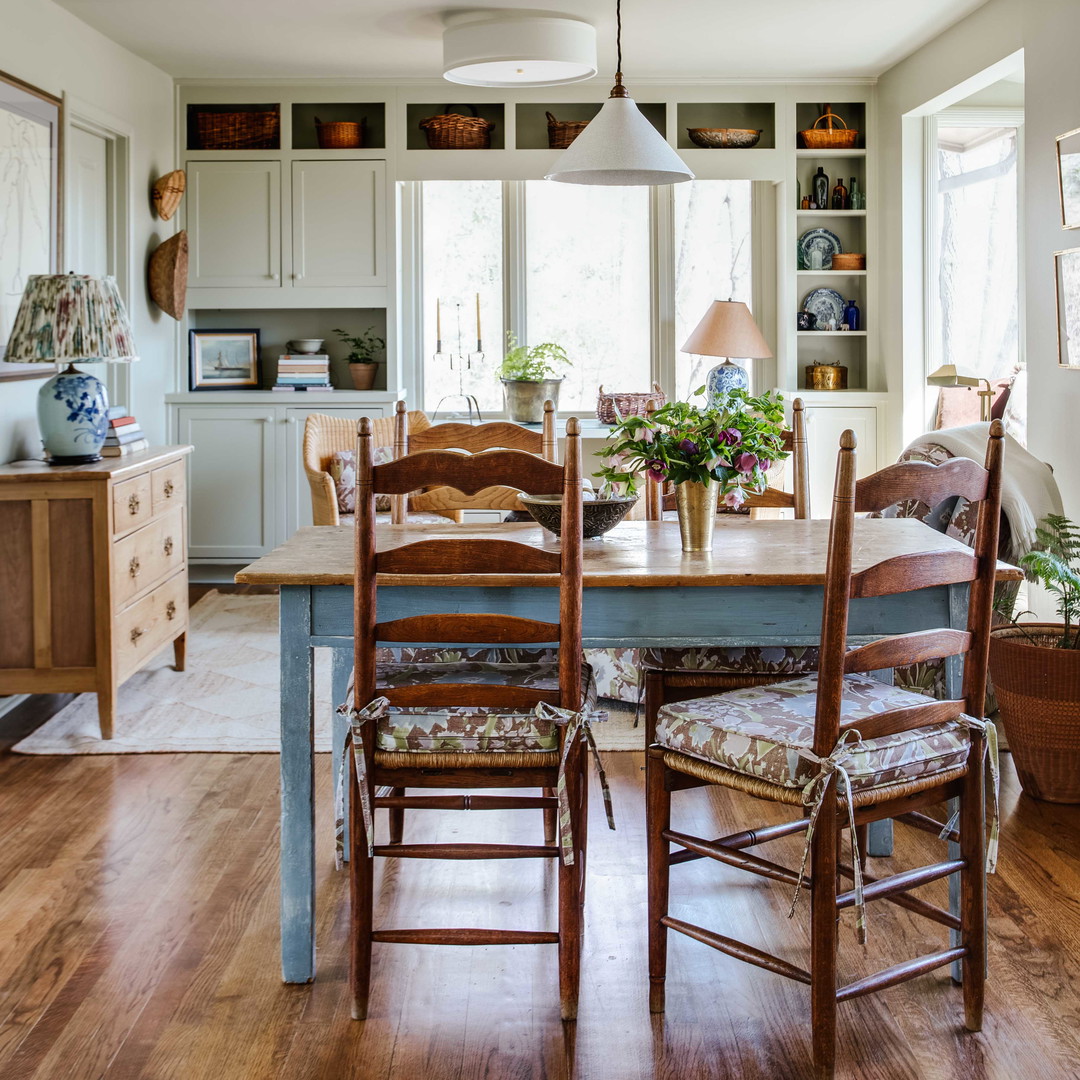 a dining room with a table and chairs