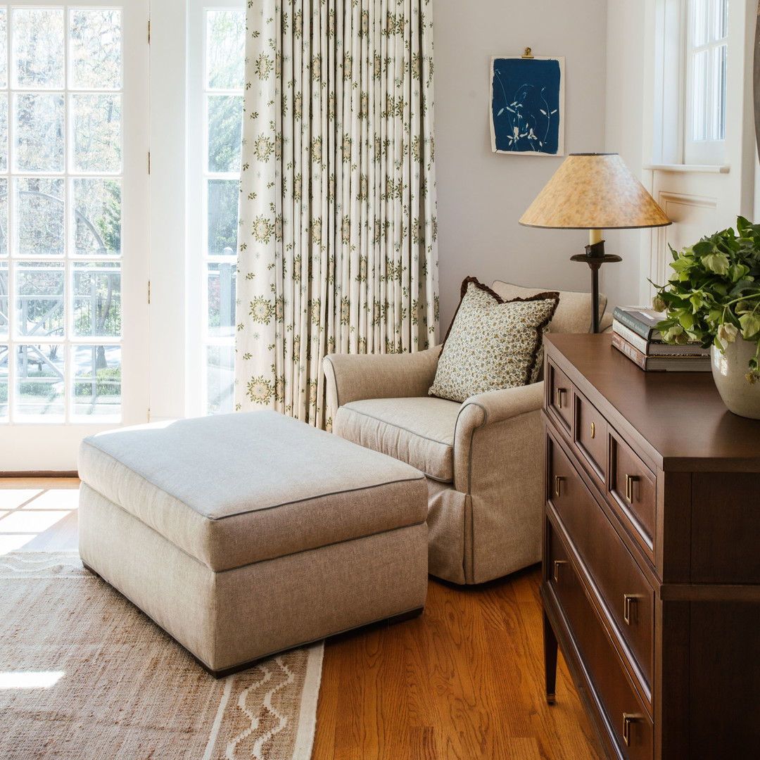 a living room filled with furniture and a large window