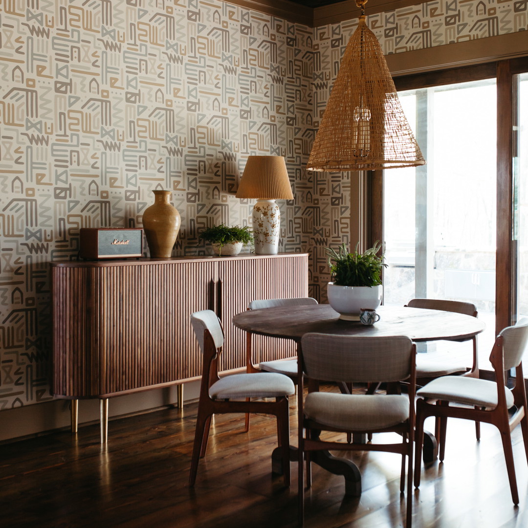 a dining room with a table and chairs