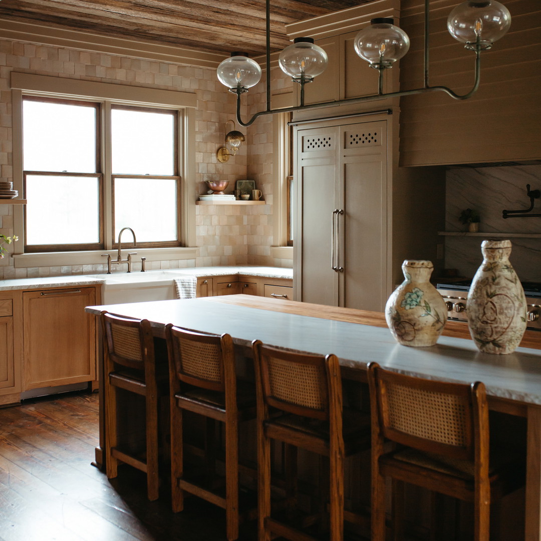 a kitchen with a center island and wooden cabinets