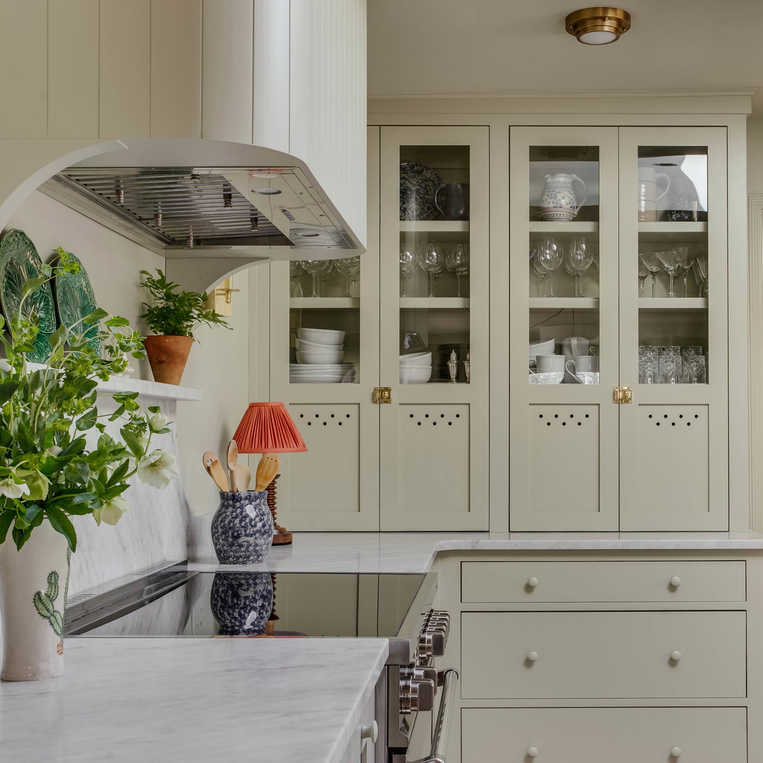 a kitchen with a stove top oven sitting inside of it