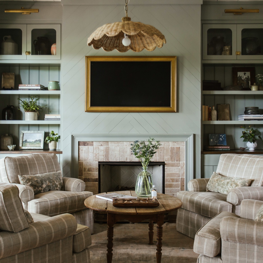 a living room filled with furniture and a fire place