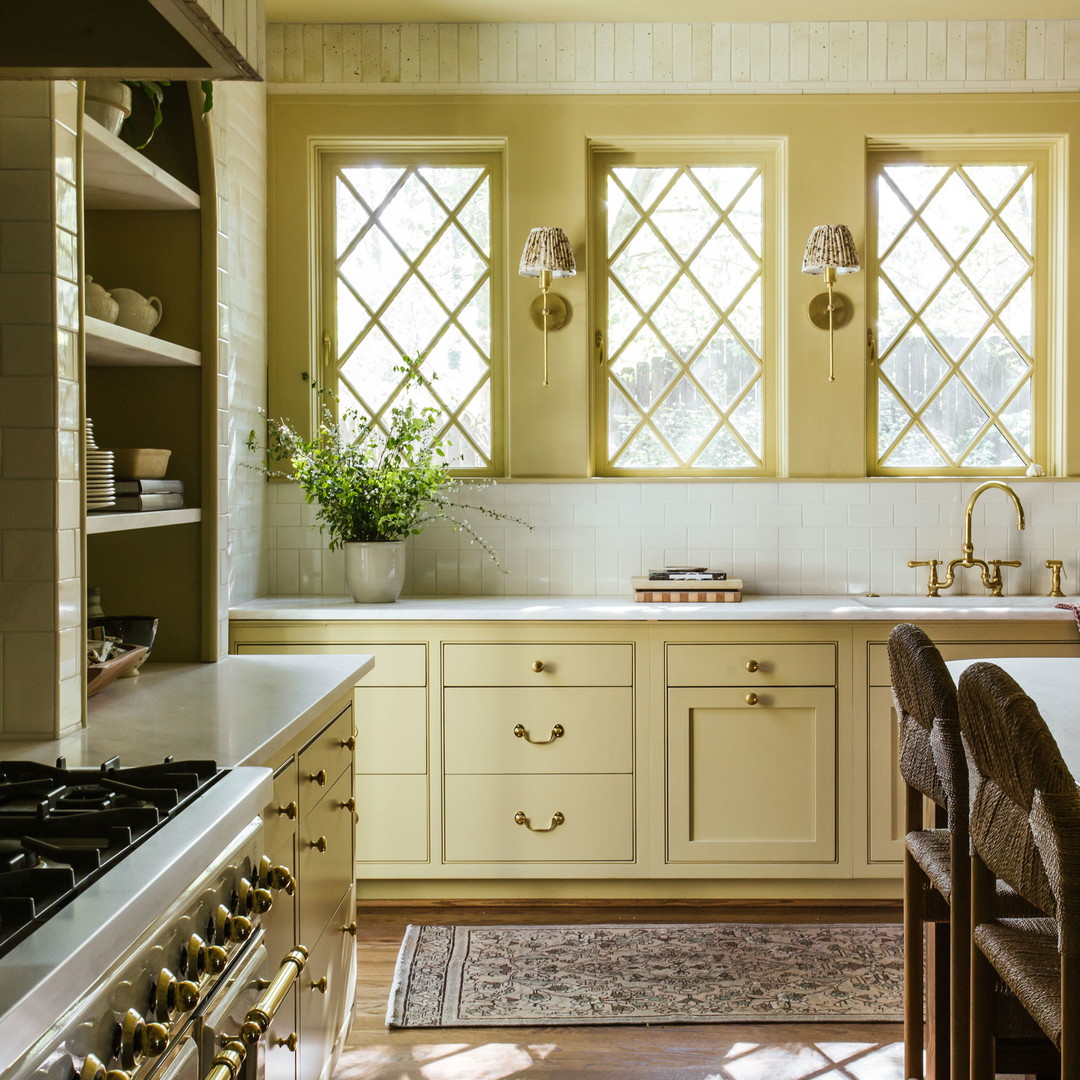 a kitchen with a stove top oven next to a sink