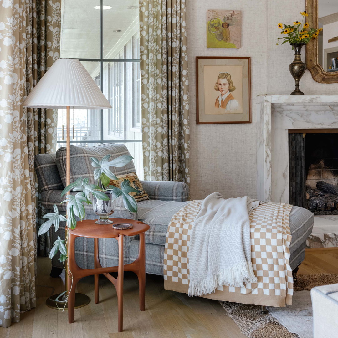 a living room filled with furniture and a fire place