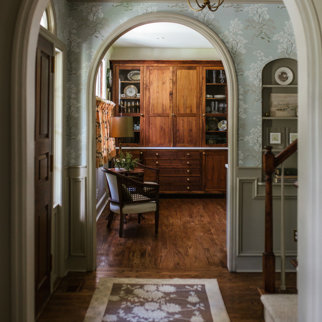 a view of a living room through an archway