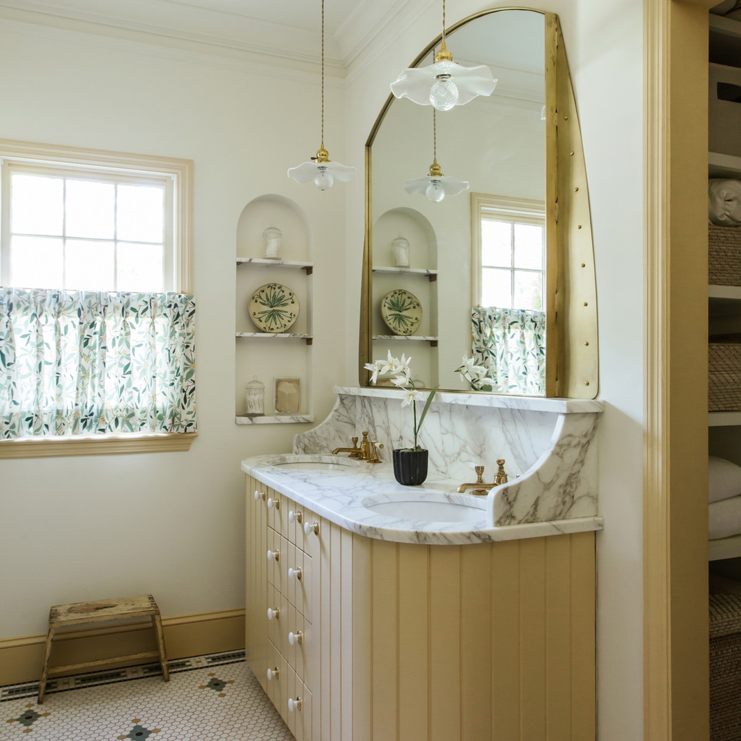 a bathroom with a large mirror and a sink