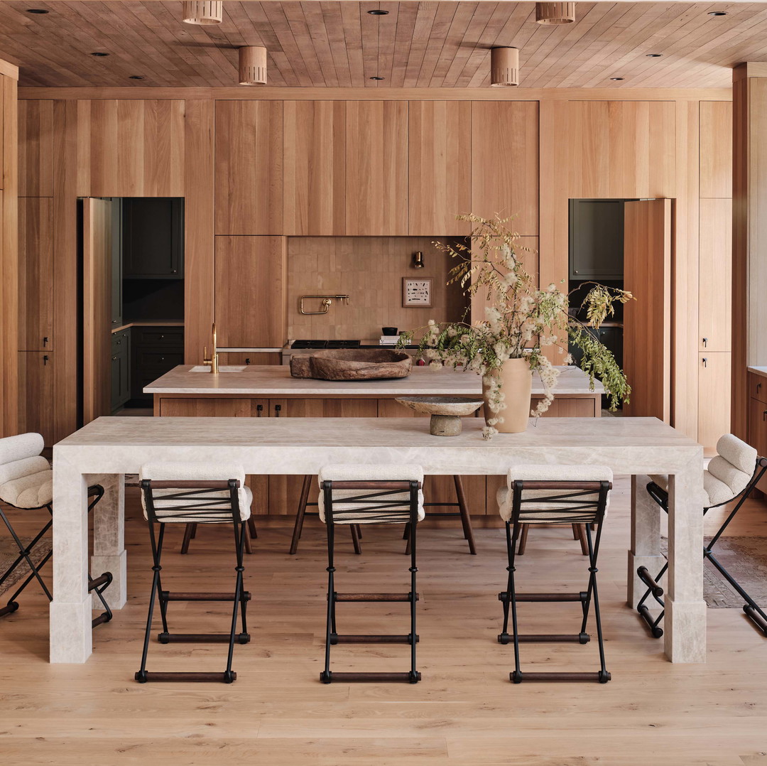 a kitchen with a table and chairs in it