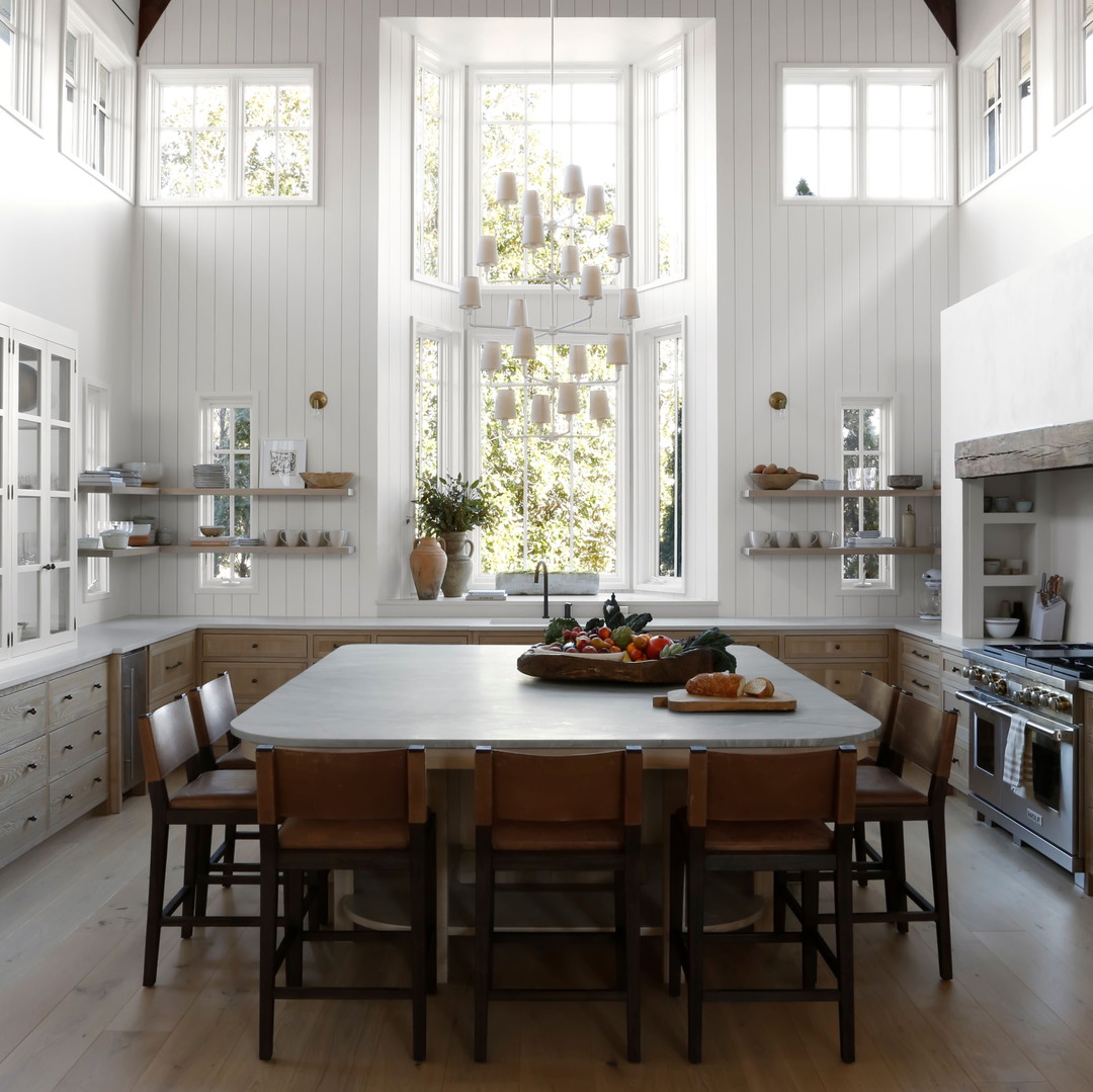 a kitchen with a table and chairs and a stove