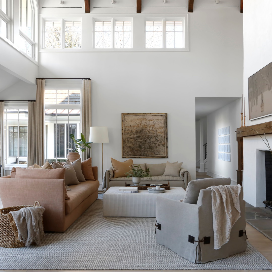 a living room filled with furniture and a fire place