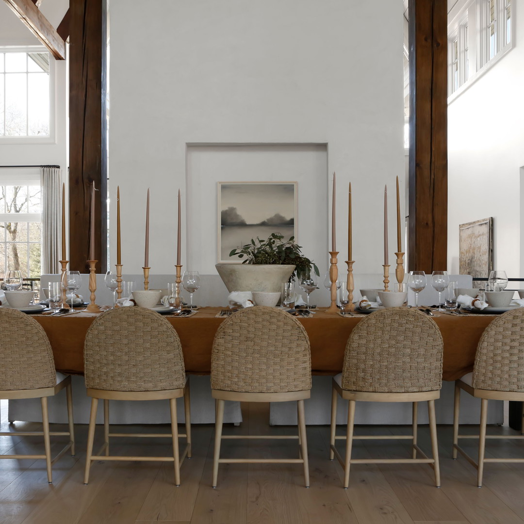 a dining room with a table and chairs