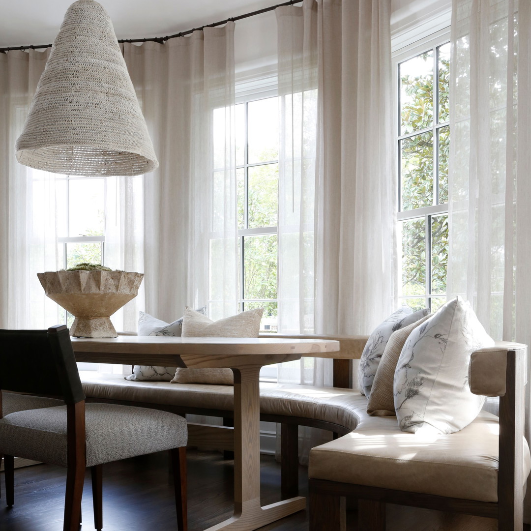 a dining room with a table and chairs