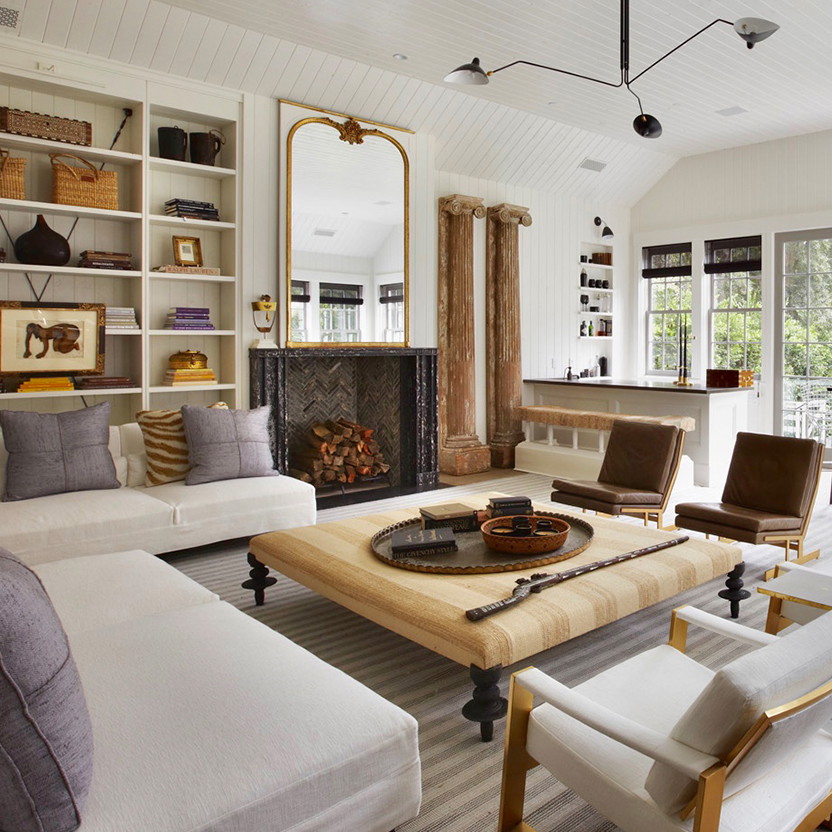 a living room filled with furniture and a fire place