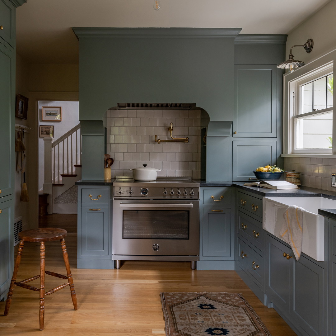 a kitchen with a stove and a sink