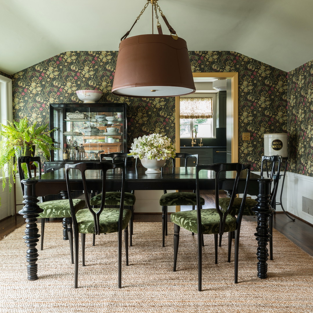 a dining room with a table and chairs