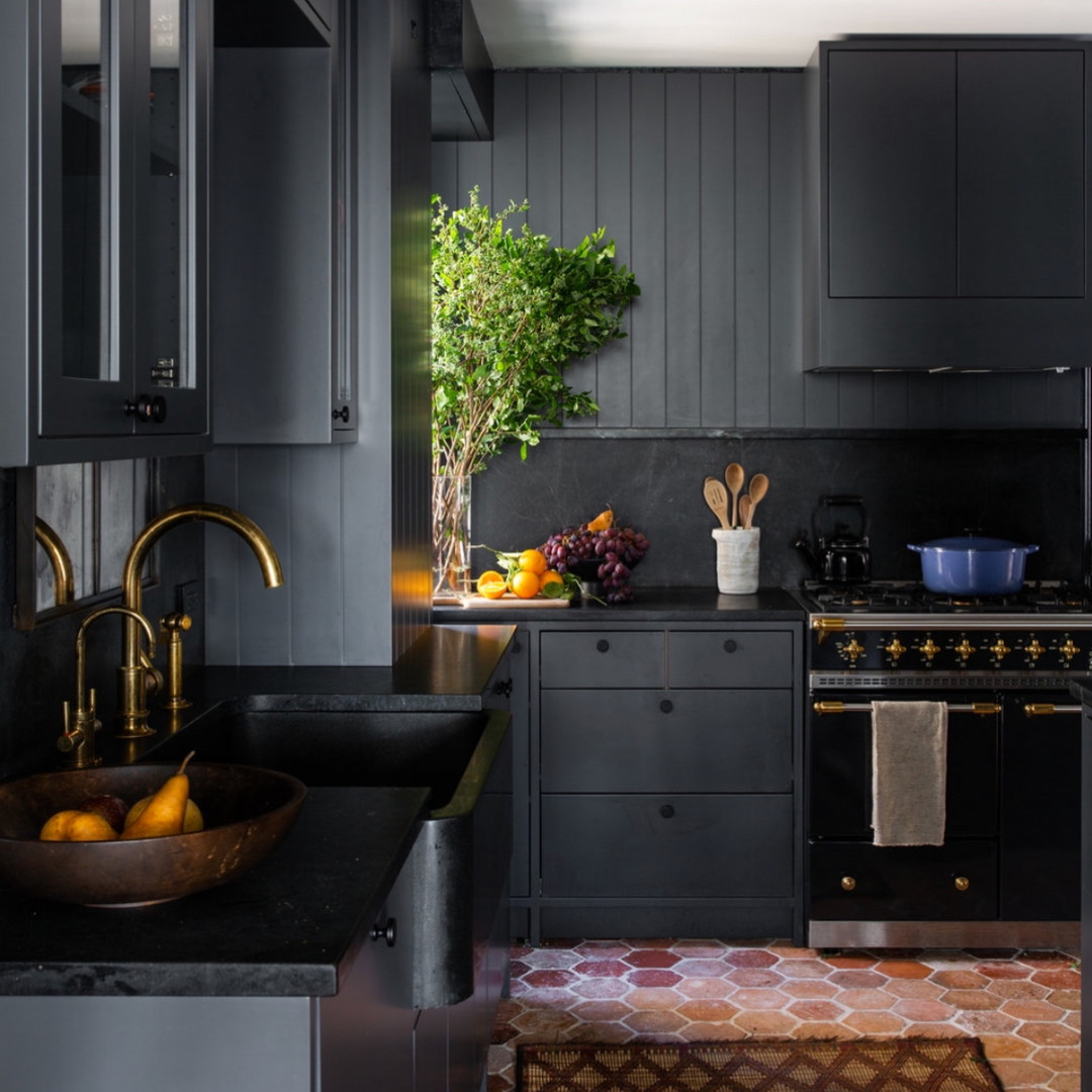 a kitchen with a sink and a stove